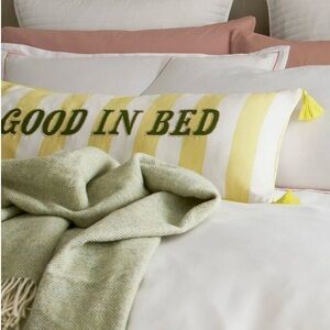 Yellow and White Striped Pillow with Green Text